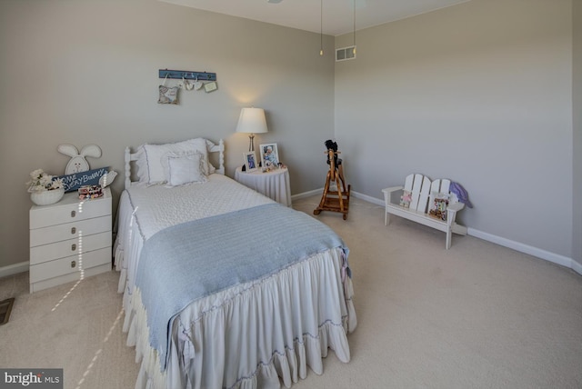 bedroom featuring carpet floors, visible vents, and baseboards