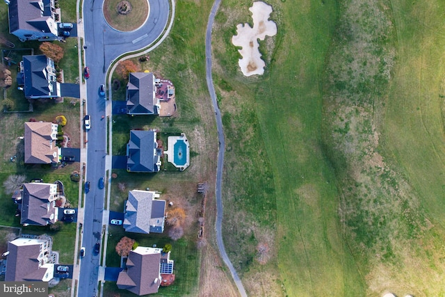 birds eye view of property with a residential view