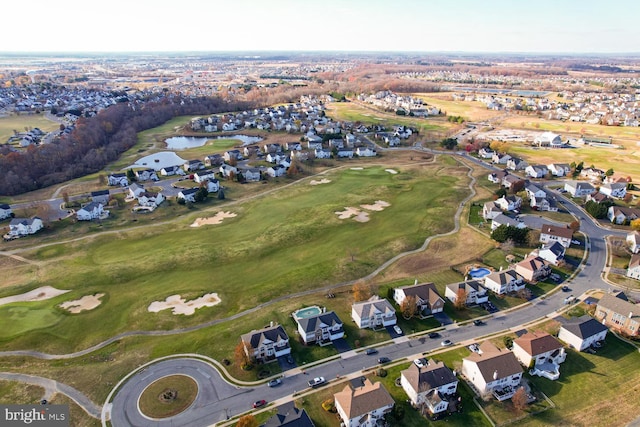 aerial view with a residential view, a water view, and golf course view