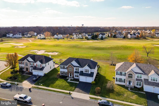 drone / aerial view featuring a residential view and view of golf course