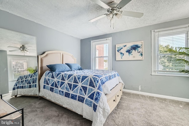 bedroom featuring a textured ceiling, ceiling fan, carpet, and baseboards