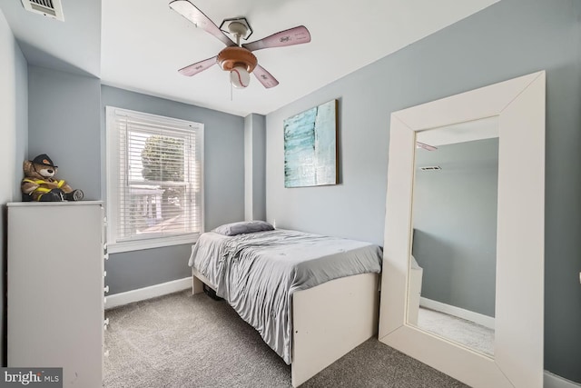 bedroom featuring ceiling fan, carpet, visible vents, and baseboards