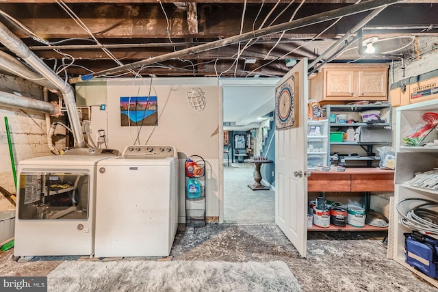 laundry area with cabinet space and independent washer and dryer