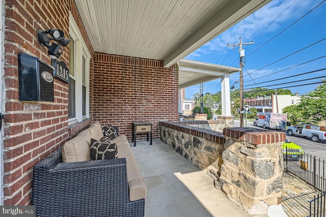 view of patio featuring fence