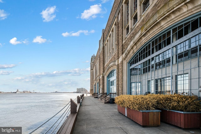 view of community with a water view