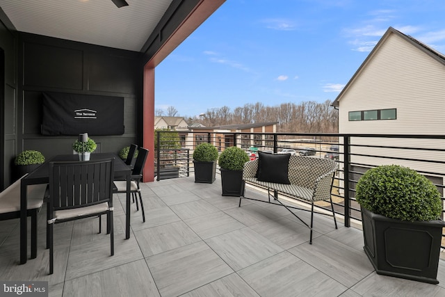 view of patio featuring a balcony