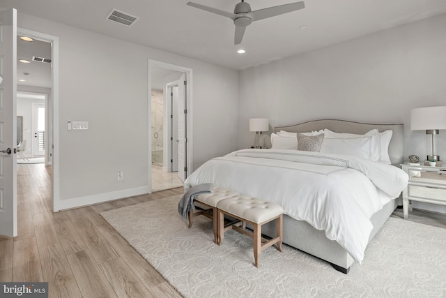 bedroom with light wood-type flooring, visible vents, baseboards, and recessed lighting