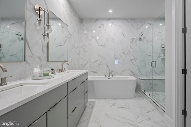 bathroom with stone wall, a marble finish shower, and a sink