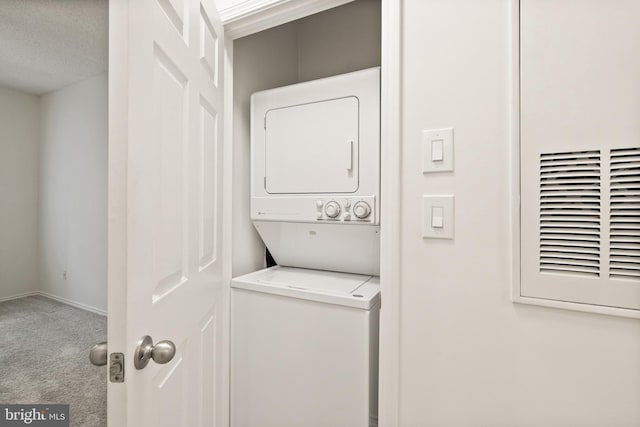 laundry area with stacked washing maching and dryer, carpet floors, laundry area, and a heating unit