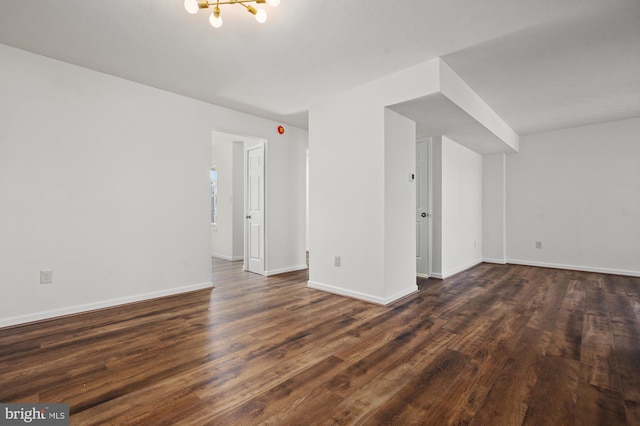 interior space with dark wood-style floors and baseboards