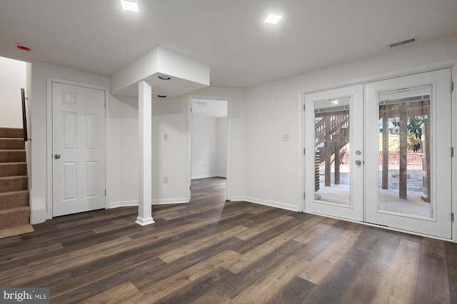 interior space with french doors, dark wood finished floors, visible vents, baseboards, and stairs