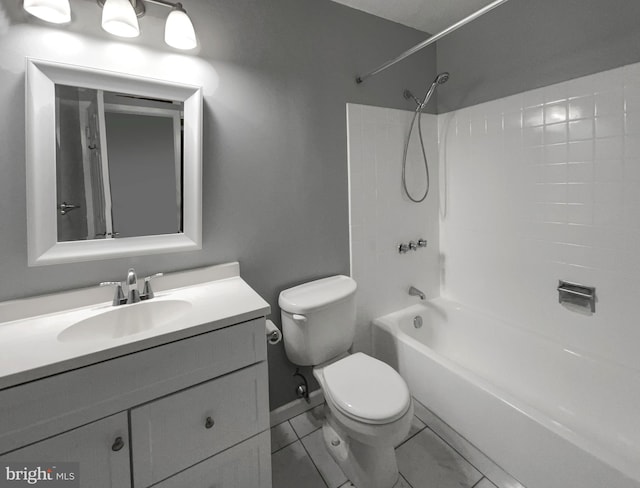 bathroom with bathing tub / shower combination, vanity, and toilet