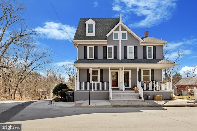 view of front of property featuring a porch and stucco siding