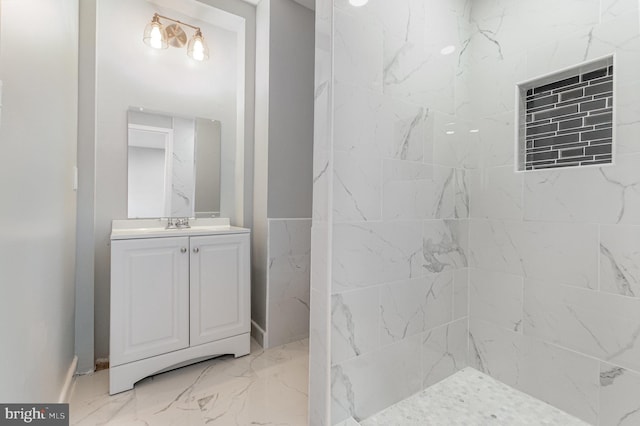 full bathroom with marble finish floor and vanity