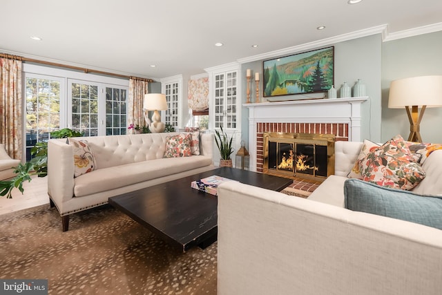 carpeted living room with ornamental molding, a brick fireplace, and recessed lighting