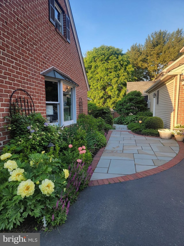 view of side of property with brick siding
