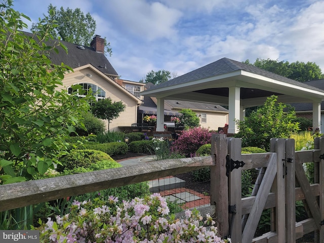 exterior space with a gate and fence