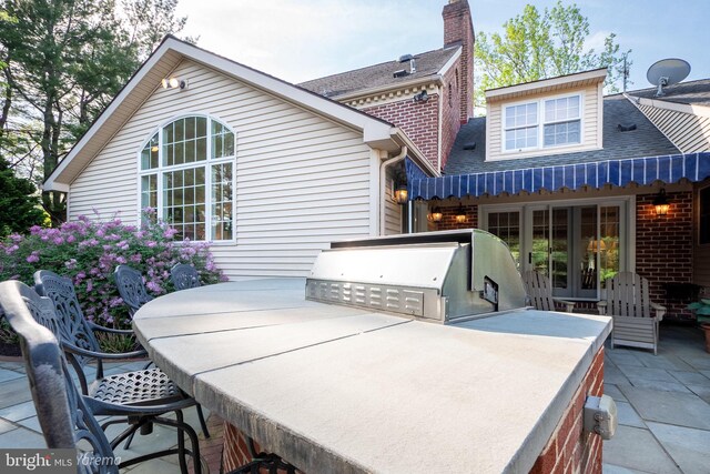 view of patio featuring area for grilling and french doors