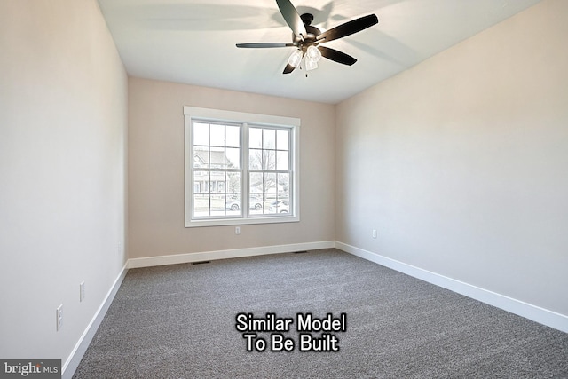 carpeted spare room with ceiling fan and baseboards