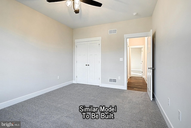 unfurnished bedroom featuring carpet, visible vents, and baseboards