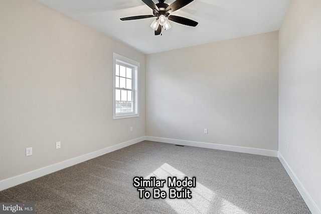 spare room with visible vents, carpet floors, a ceiling fan, and baseboards