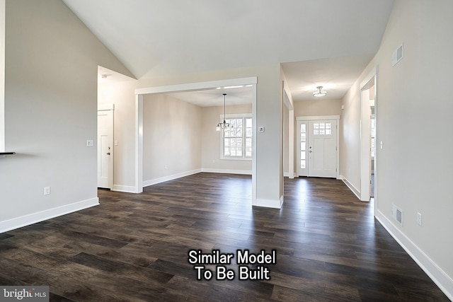 entrance foyer featuring lofted ceiling, baseboards, visible vents, and dark wood-style flooring