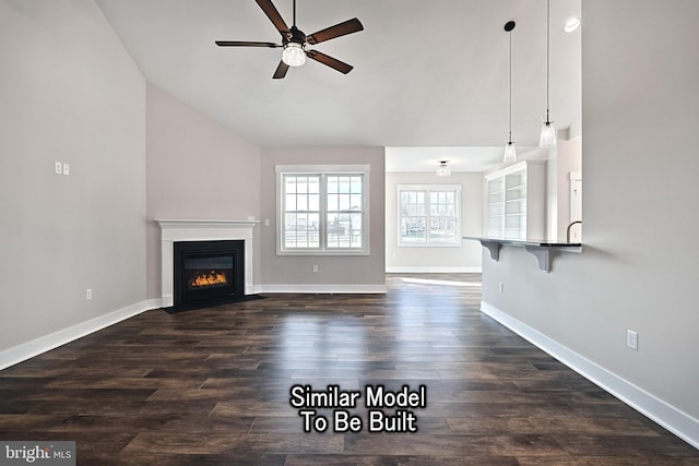 unfurnished living room featuring a fireplace with flush hearth, dark wood-style flooring, ceiling fan, and baseboards