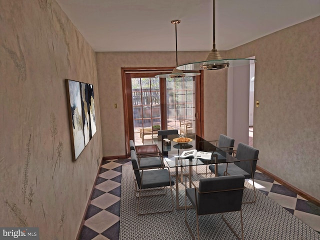 dining space featuring baseboards and tile patterned floors