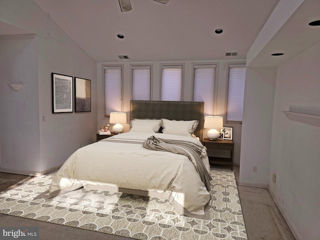 bedroom featuring lofted ceiling, baseboards, visible vents, and a ceiling fan