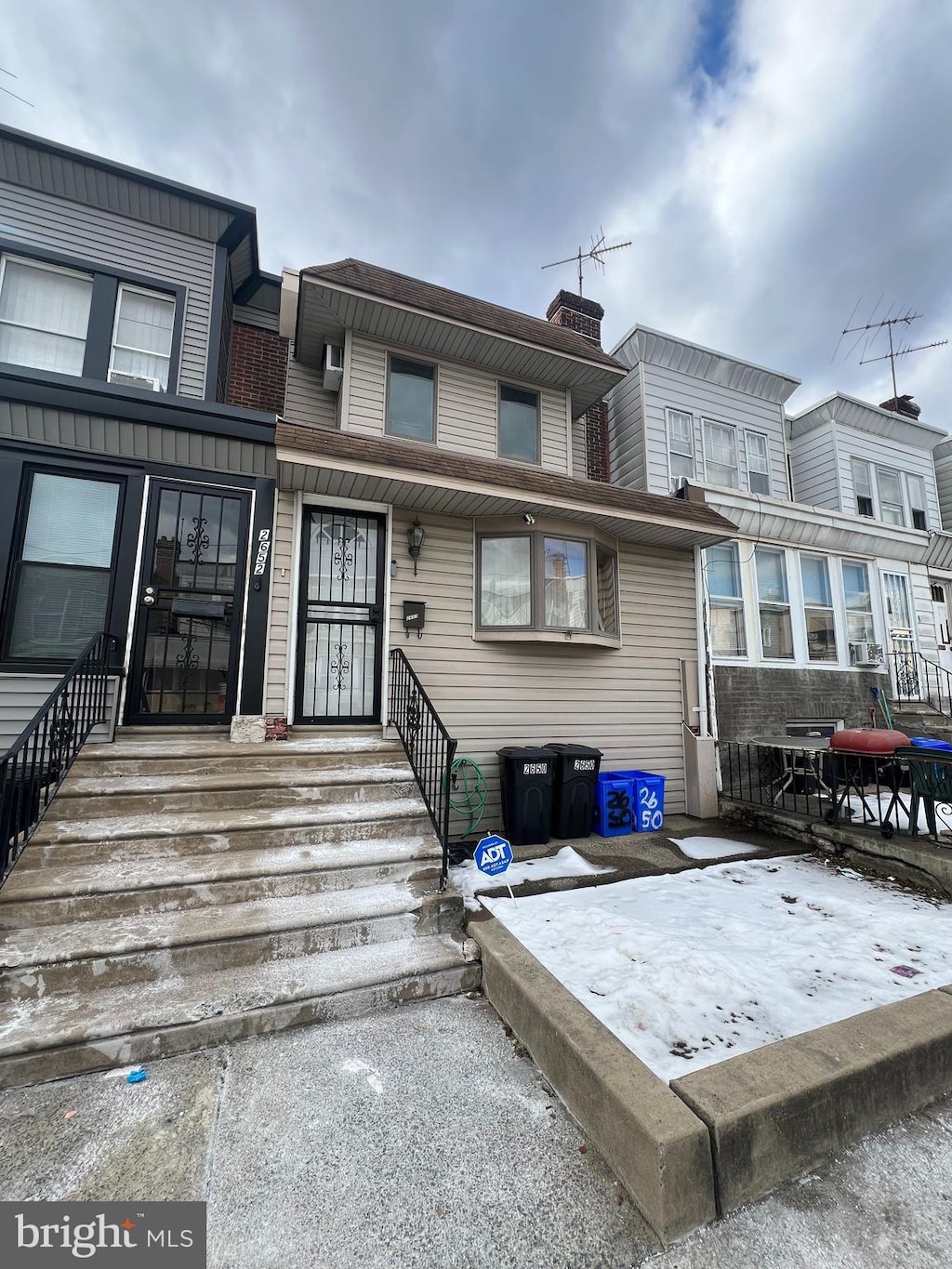 townhome / multi-family property featuring a chimney