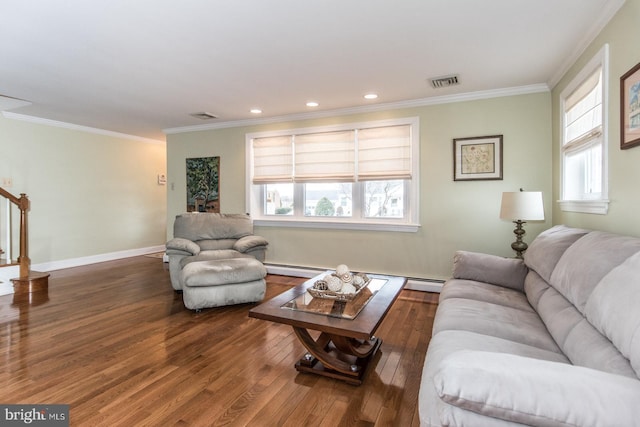 living room with stairs, wood finished floors, visible vents, and crown molding