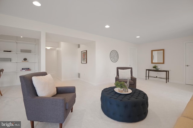 living area with visible vents, recessed lighting, baseboards, and carpet floors