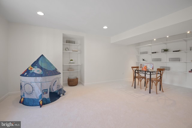 carpeted dining space with built in features, recessed lighting, and baseboards