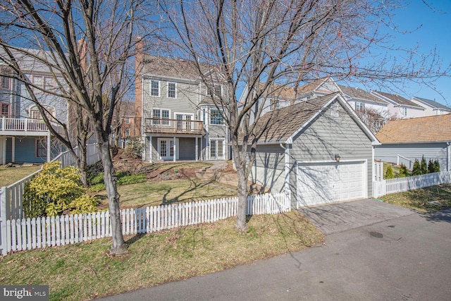 view of front facade with a fenced front yard and an outdoor structure