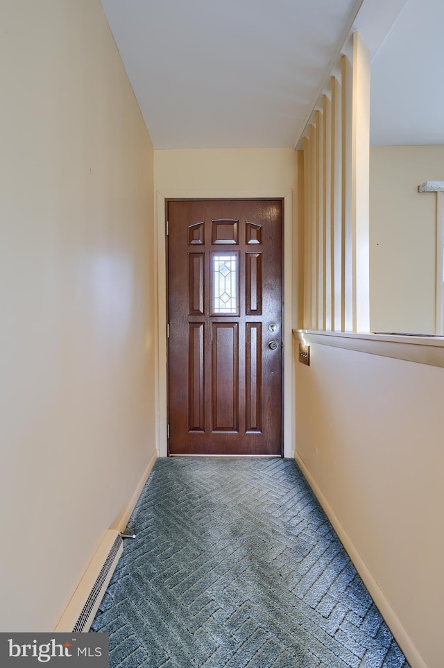 doorway to outside with carpet, visible vents, and baseboards