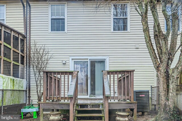 back of house with fence