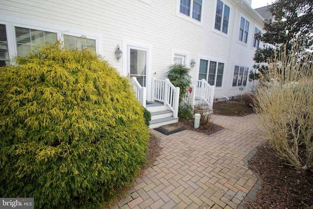 view of side of home featuring crawl space and a patio