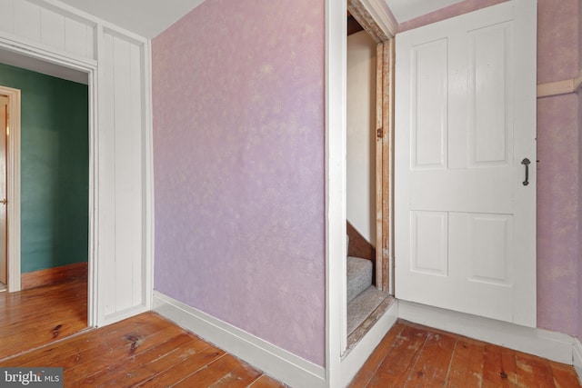 interior space with hardwood / wood-style floors and baseboards