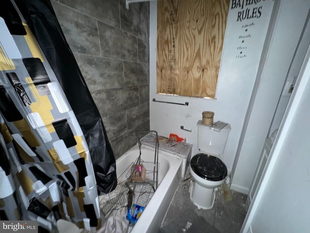 bathroom featuring a bathing tub and toilet