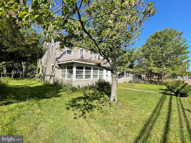 view of yard with a sunroom