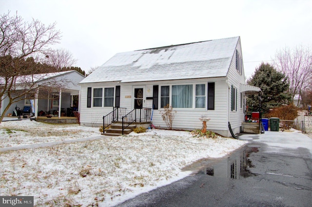 view of front facade with a shingled roof