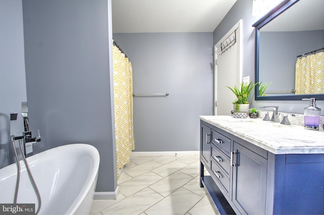 bathroom featuring double vanity, marble finish floor, baseboards, and a soaking tub