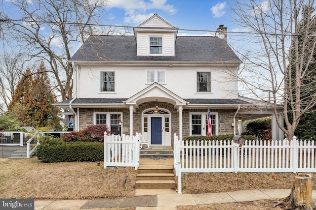 view of front of home featuring roof with shingles, a chimney, stucco siding, fence, and stone siding