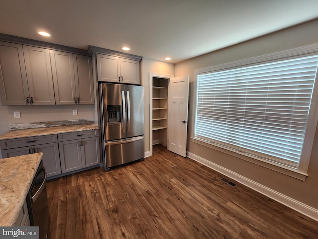 kitchen featuring visible vents, dark wood finished floors, gray cabinetry, stainless steel refrigerator with ice dispenser, and recessed lighting