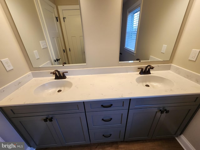 bathroom featuring double vanity and a sink