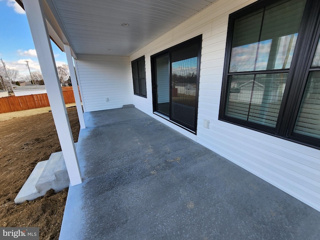 view of patio / terrace featuring fence