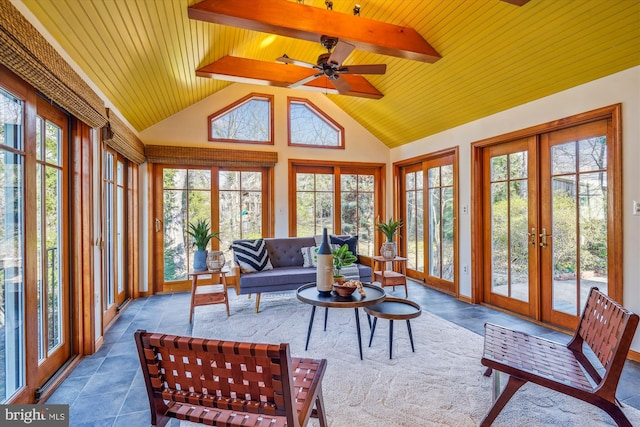 sunroom with a ceiling fan, wood ceiling, french doors, and vaulted ceiling with beams