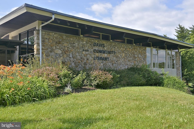 exterior space with stone siding