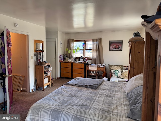 bedroom with carpet flooring and baseboards