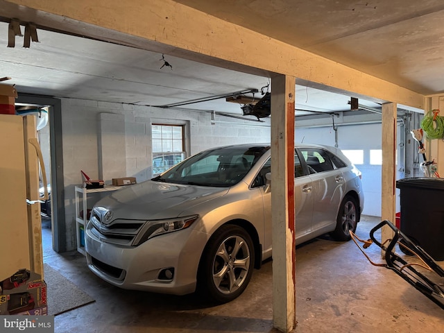 garage with concrete block wall